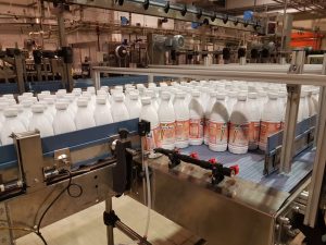 Linea di imbottigliamento del latte con macchine nuove e usate integrate